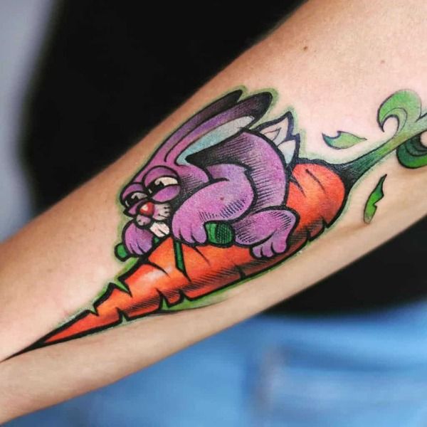Tattoo thỏ cưỡi tên lửa cà rốt